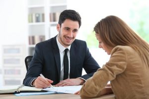 Woman meeting financial adviser in office